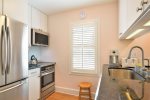 Newly renovated kitchen with SS appliances including dishwasher, microwave, stove, refrigerator w/ice-maker